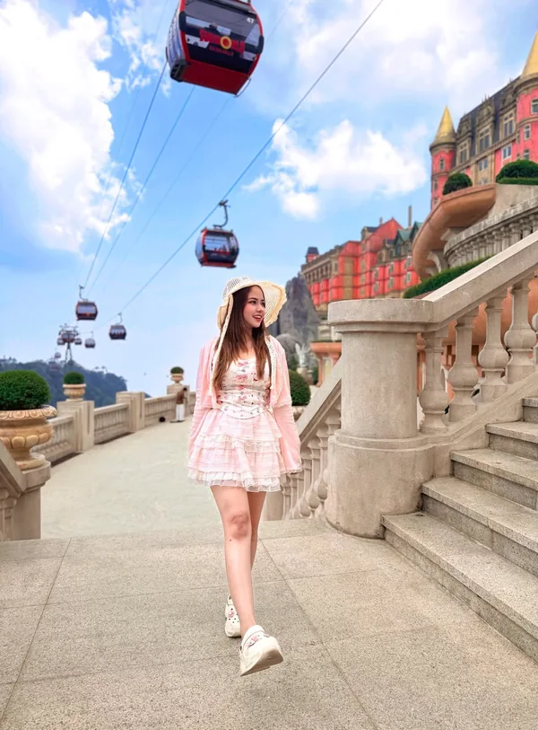 Ba Na Hills French Village with red cable cars passing overhead — arrive early for the best experience