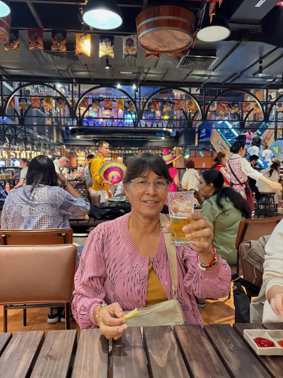Guest inside Beer Plaza buffet restaurant at Ba Na Hills enjoying the lively Bavarian-themed dining hall with live entertainment