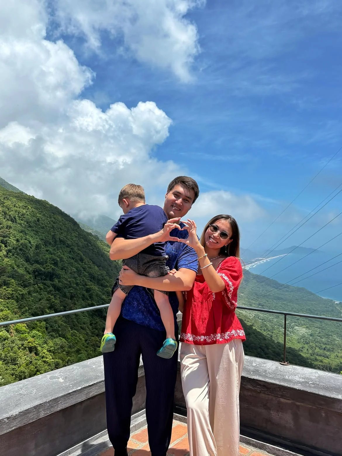Family at Hai Van Pass viewpoint on the private car route from Da Nang to Hue
