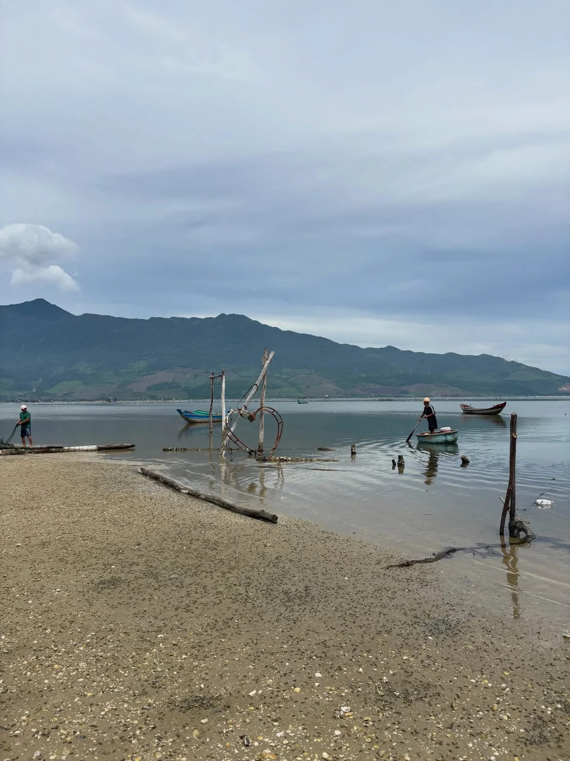 Lap An Lagoon with fishing boats and mountains on the Da Nang to Hue route