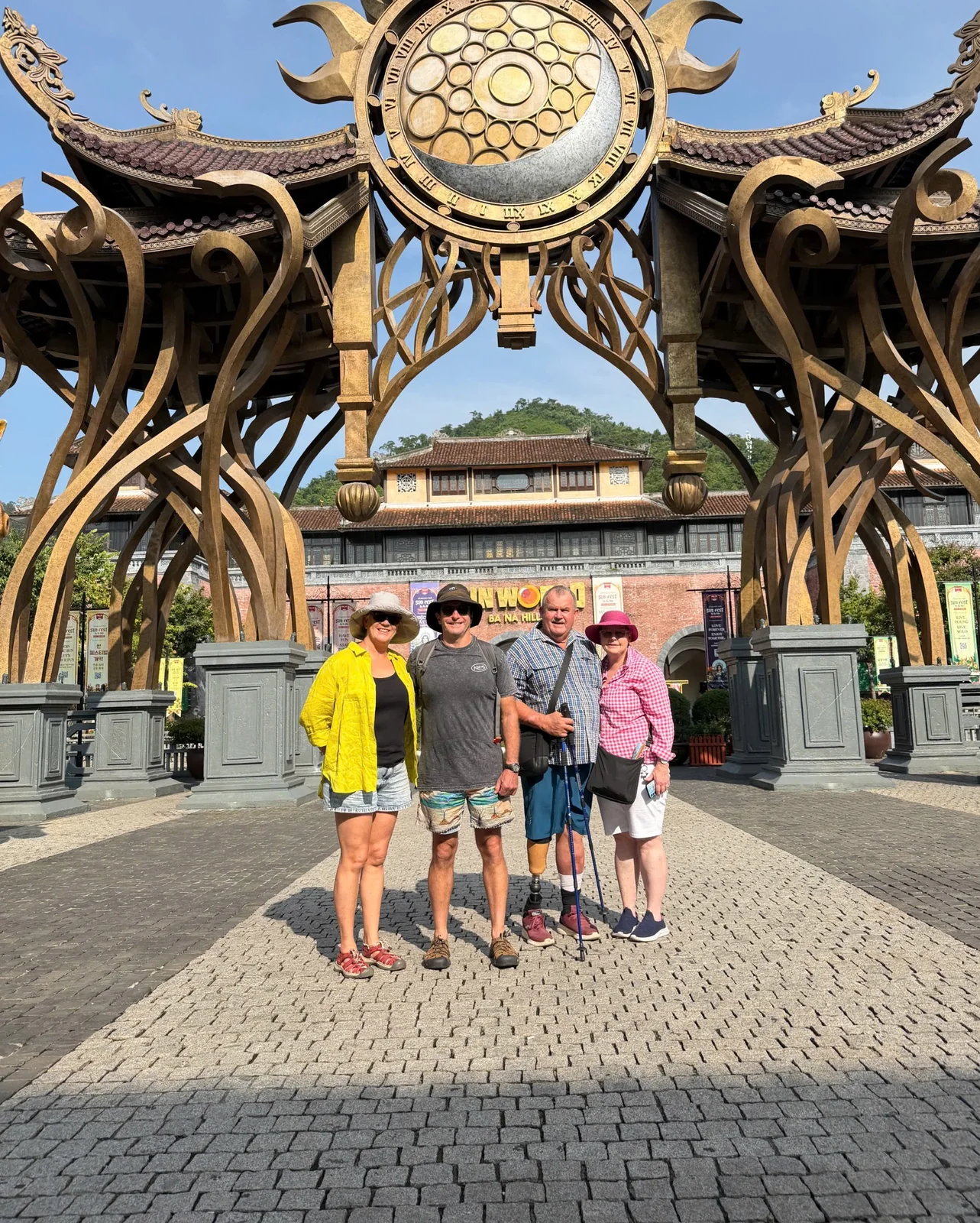 Small group at Ba Na Hills Golden Bridge entrance during private car and ticket package from Da Nang
